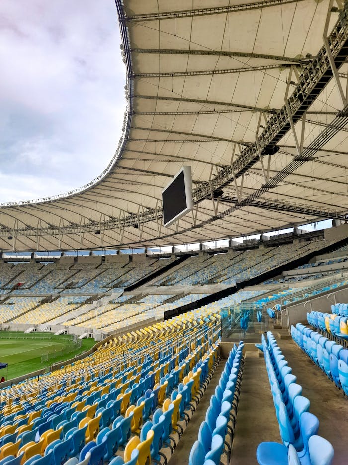 Empty seats and architecture of Maracanã Stadium captured in daylight.